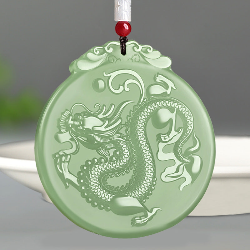 Chinese Zodiac Dragon Jade Necklace - frontal close-up of circular jade dragon pendant with pearl motif, luck