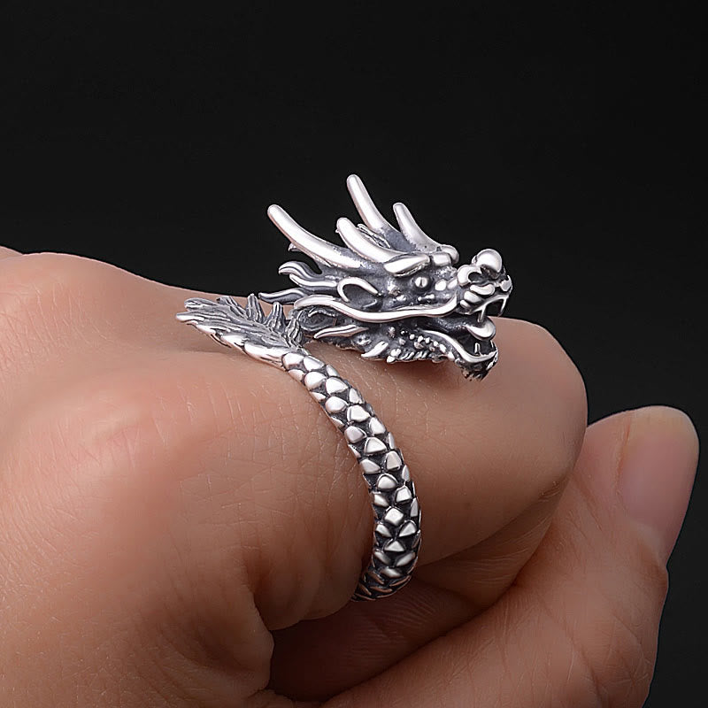 Sterling Silver Dragon Ring - worn on hand against black, open jaw and horn detail, powerful