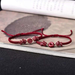 Cinnabar PiXiu Copper Coin Red String Bracelet – Two red cord bracelets with PiXiu on book, couple luck set