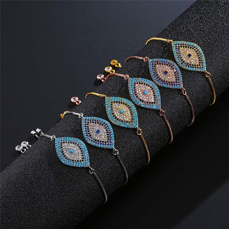 Evil Eye Healing Bracelet – Six evil eye bracelets in silver gold rose gold on black velvet display stand