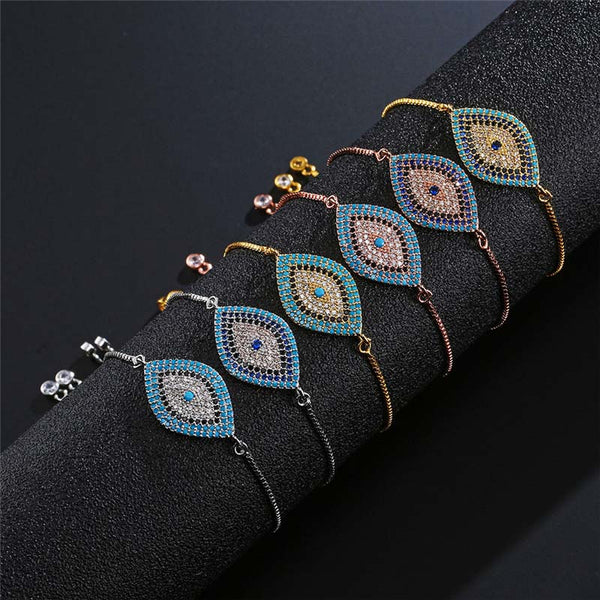 Evil Eye Healing Bracelet – Six evil eye bracelets in silver gold rose gold on black velvet display stand