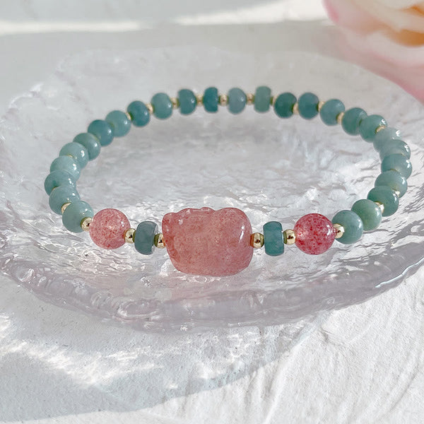 Hetian Jade Pearl Fu Gourd Money Bag Bracelet – Pink strawberry quartz PiXiu on crystal plate close-up, love wealth bracelet