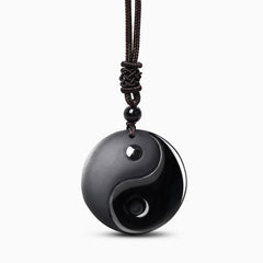 Black Obsidian Nine-Character Mantra Necklace – Yin-Yang obsidian pendant on braided cord, white background studio shot