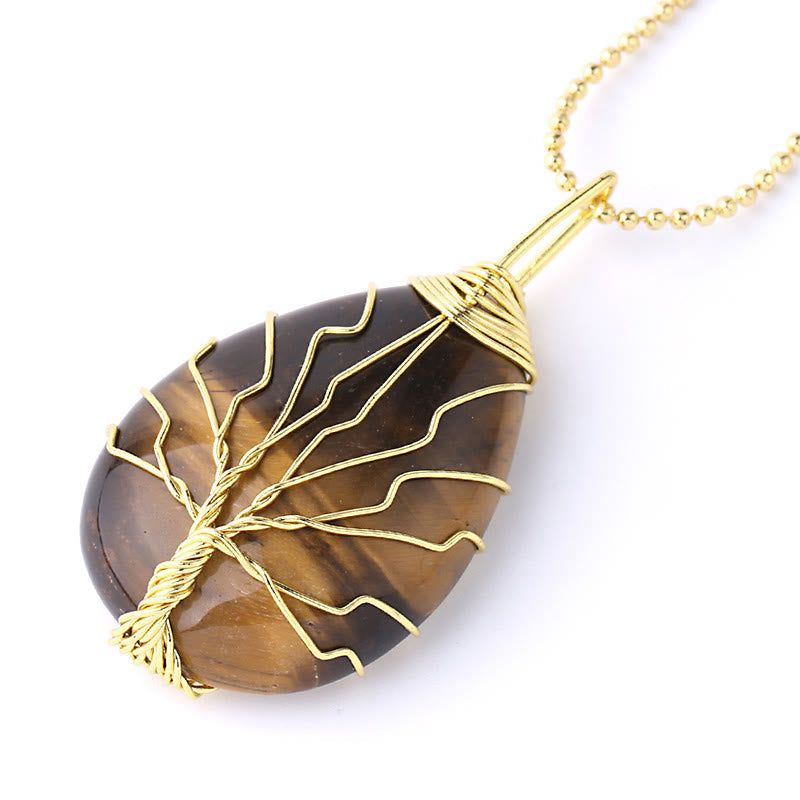 Quartz Crystal Tree of Life Necklace – tiger eye pendant, gold wire tree, three-quarter angle, protection