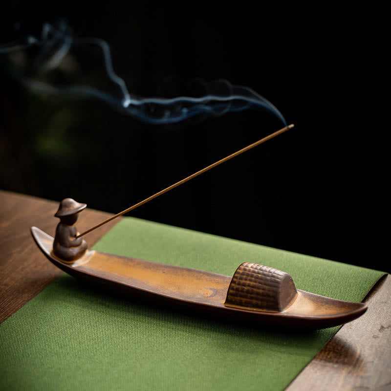 Lonely Fisherman Incense Burner – Brown boat with basket detail on green fabric, smoke, zen art