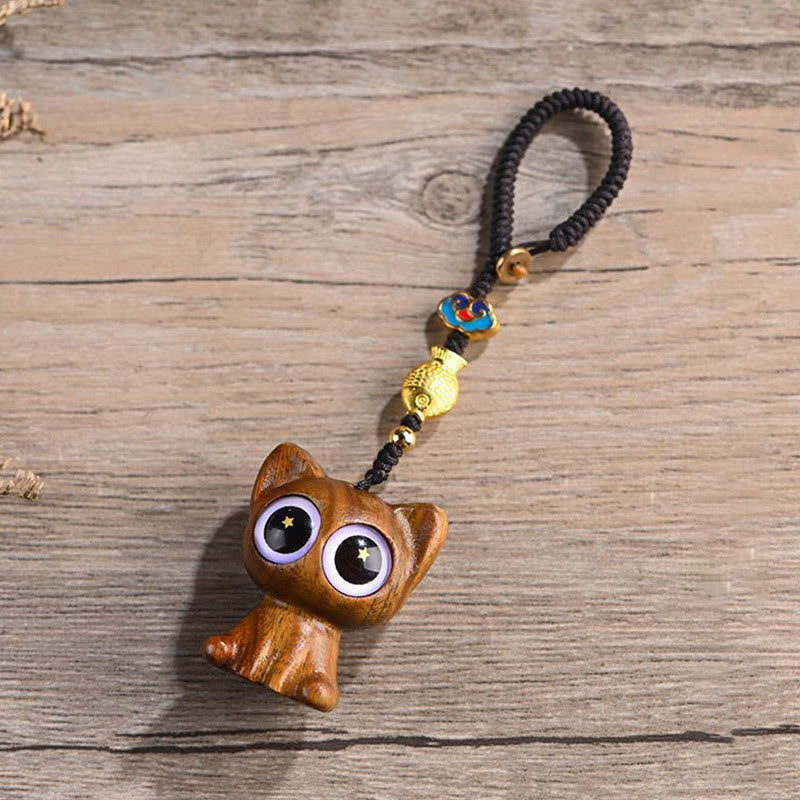 Green Sandalwood Key Chain – attached to phone, lucky cat koi fish charm in use