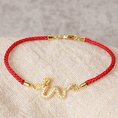 925 Silver Dragon Bracelet - Gold dragon on braided red cord over natural linen, cultural jewelry