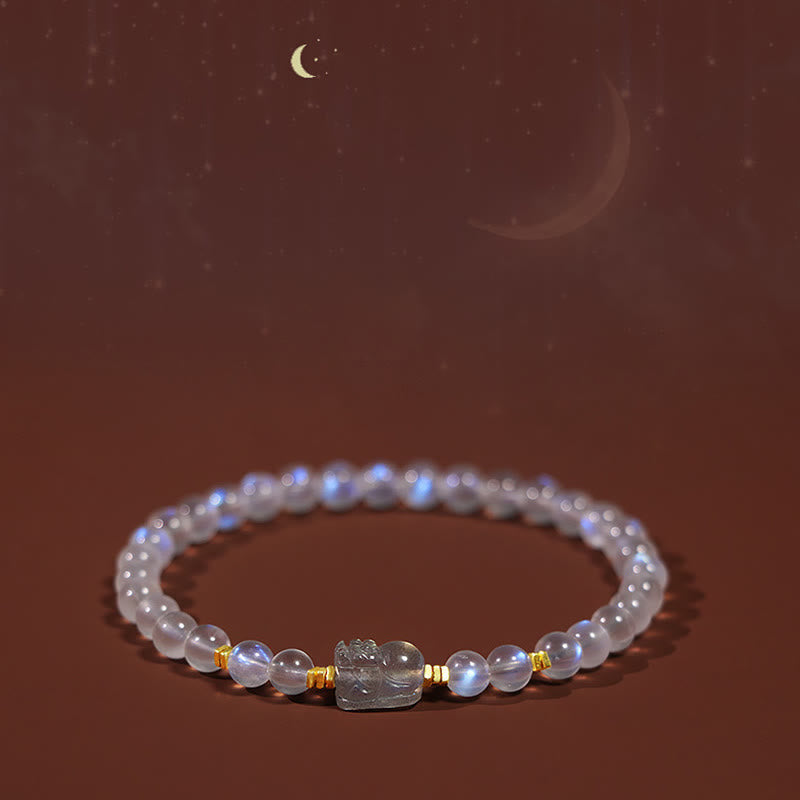 Moonstone PiXiu Bracelet – Bracelet under starry moonlit brown background with celestial glow, healing