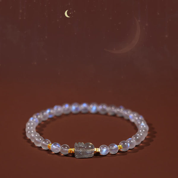 Moonstone PiXiu Bracelet – Bracelet under starry moonlit brown background with celestial glow, healing