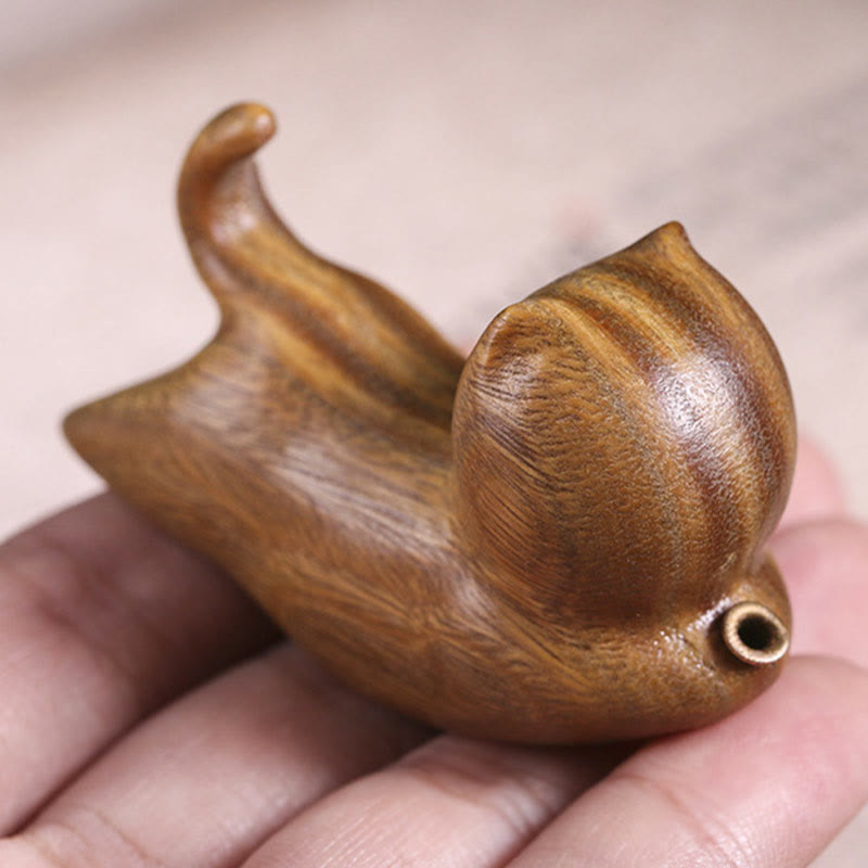 Green Sandalwood Cat Incense Burner - Cat figurine held in palm for scale, handcrafted