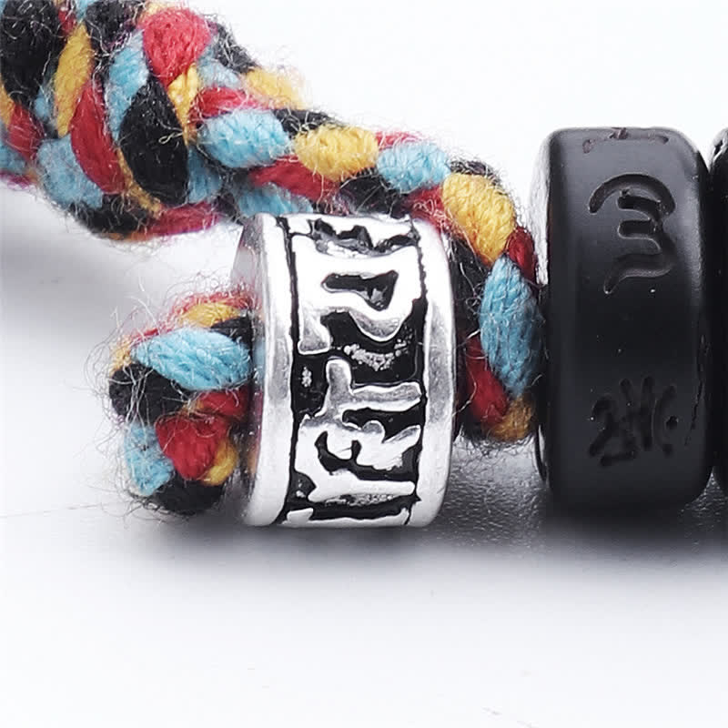 Coconut Shell Mantra Bracelet - Silver guru bead with woven multi-color cord, clasp detail, Buddhist wrist mala