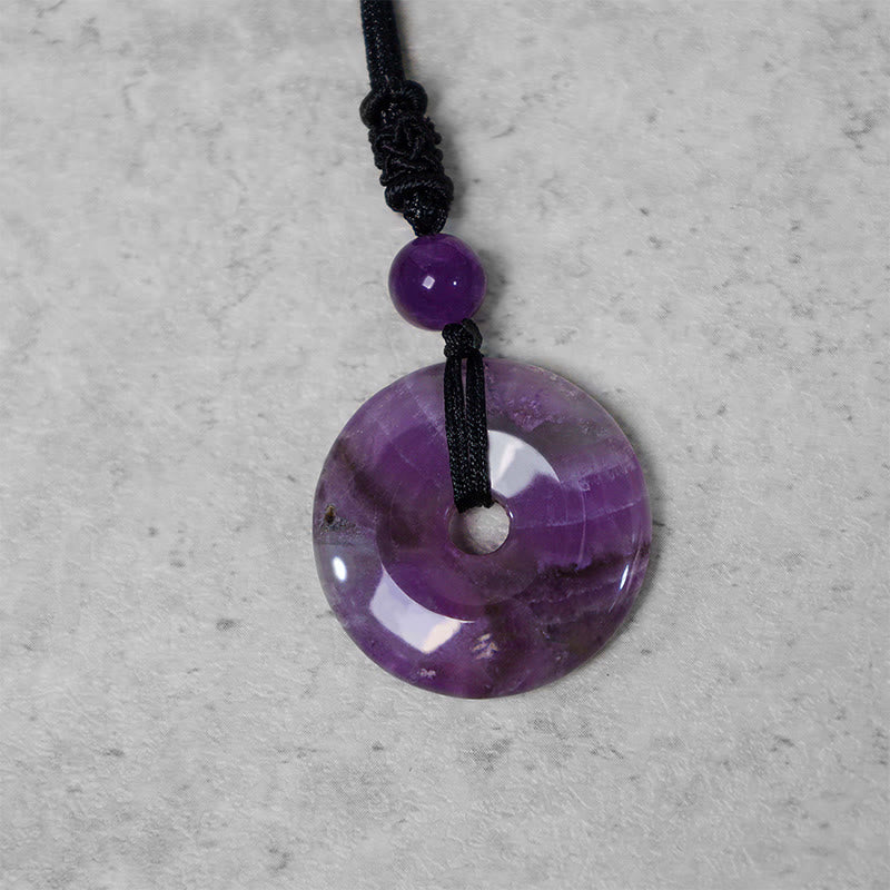 Lucky Coin Pendant Healing Crystal Gemstone Necklace – Polished amethyst bi disc with violet-lavender banding on braided cord