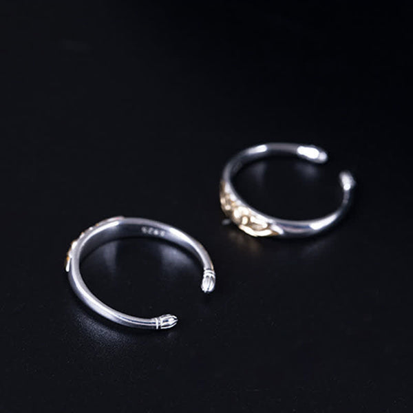 925 Sterling Silver Lotus Ring – Two rings with snake head terminals and 925 stamp on black, sterling silver