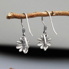 925 Sterling Silver Lotus Flower Enlightenment Earrings close-up on branch