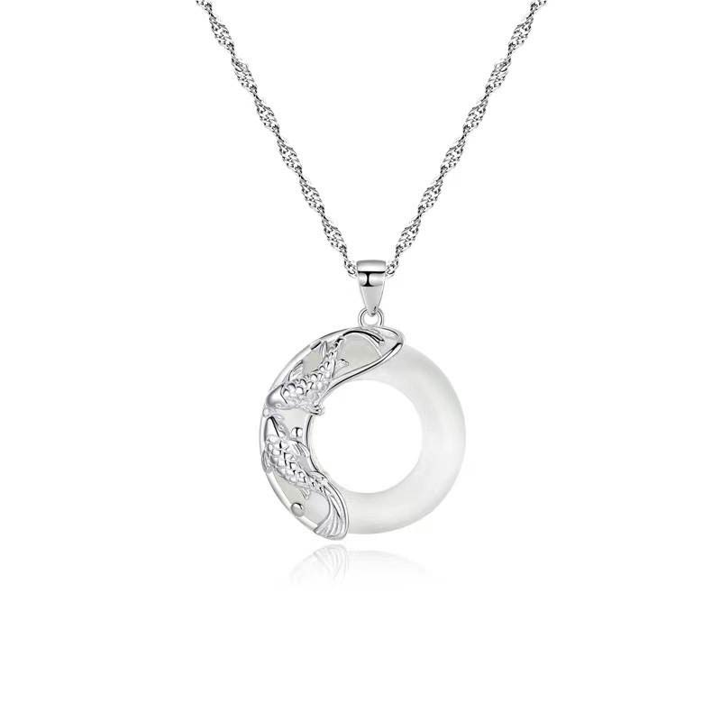 Sterling silver koi fish pendant necklace with white jade circle, Singapore twist chain, yin-yang design studio product photography