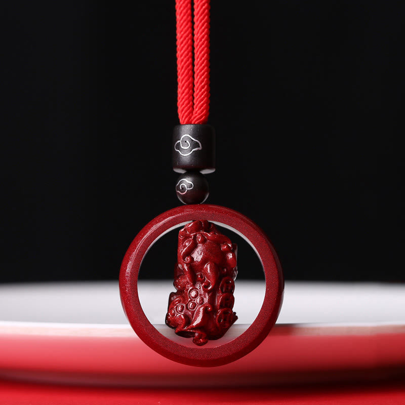 Cinnabar PiXiu Necklace – Red cord cloud-bead version on black background, elegant close-up, prosperity jewelry