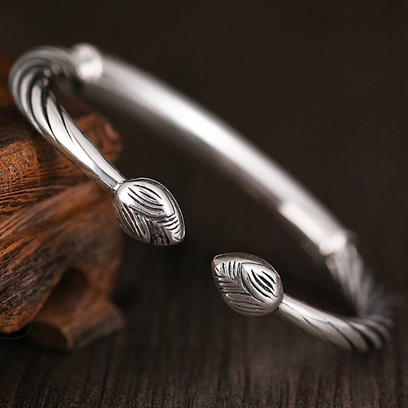Tibetan Heart Sutra Cuff Bracelet – twisted rope band with teardrop finials on weathered wood, artisan silver cuff
