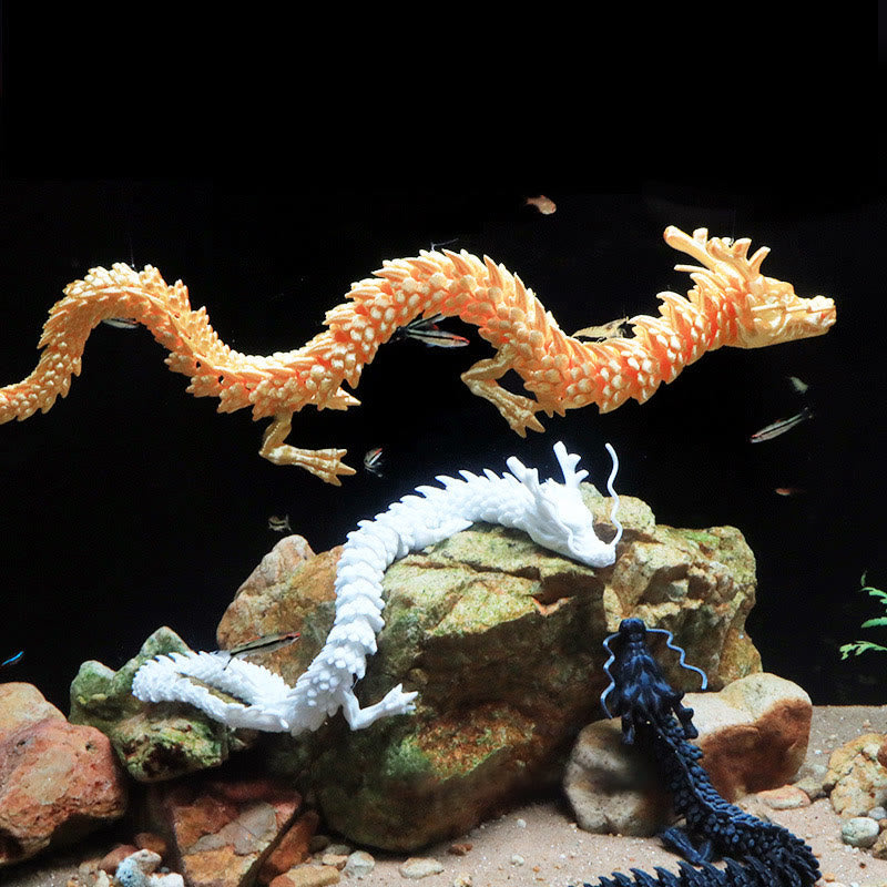 Feng Shui 3D Dragon - Three articulated dragons in orange white and blue swimming in aquarium with fish, luck