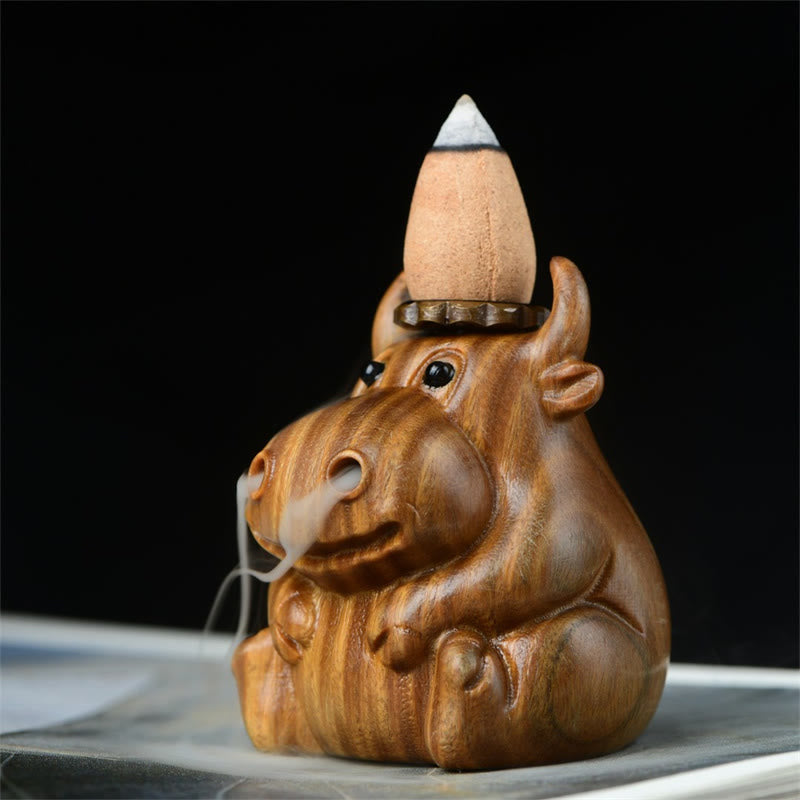 Green Sandalwood Backflow Incense Burner – Lit cone on head, wispy smoke trails from nostrils