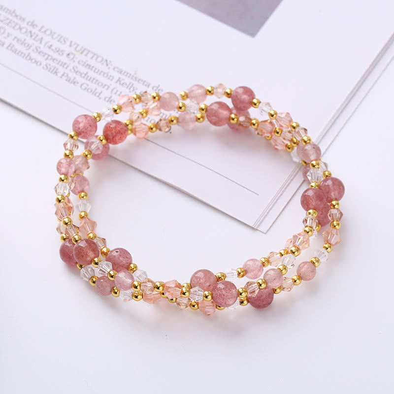 Strawberry quartz triple-strand bracelet on fashion magazine page with Louis Vuitton text, pink gemstone beads with faceted crystal and gold spacer beads, boho jewelry