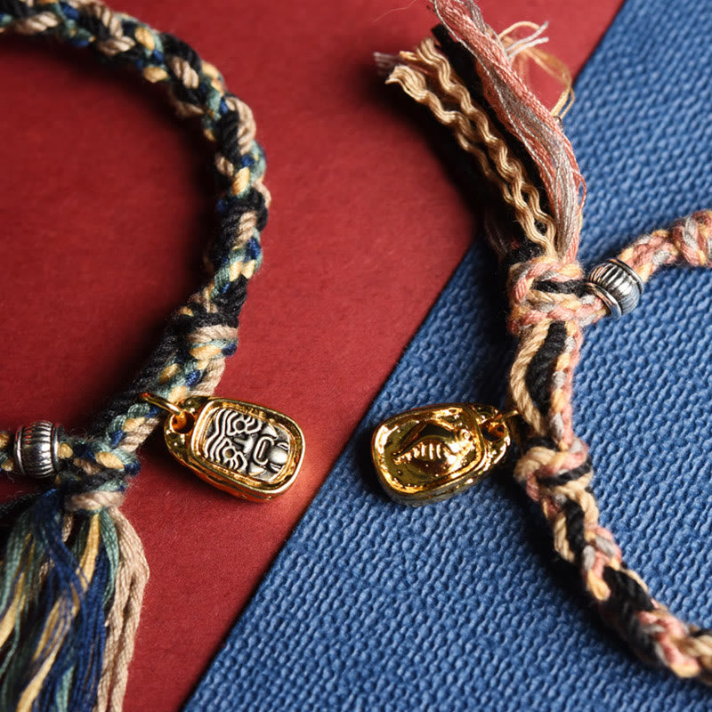 Zakiram Goddess Bracelet – Two colorway comparison showing blue and pink braided variants with charm pendants