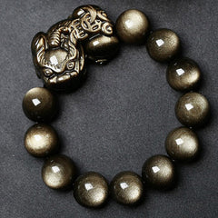 Golden Obsidian Bracelet – Circular layout on black background, shiny gold sheen obsidian beads