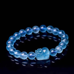 Natural Aquamarine PiXiu Serenity Bracelet – Translucent aquamarine bead bracelet with PiXiu charm on black, healing jewelry