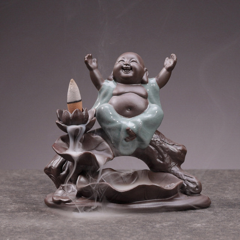 Little Monk Ceramic Incense Burner - Joyful monk with arms raised, backflow smoke over lotus petals, ceramic aromatherapy decor