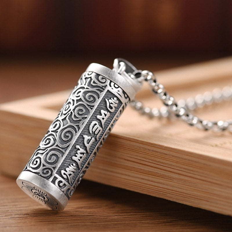 Om Mani Padme Hum Silver Protection Necklace – Antique silver prayer wheel pendant necklace with Tibetan mantra inscription, spiral cloud motifs and sunburst emblem base on rolo chain
