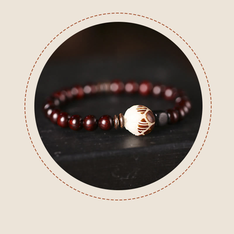 Red Sandalwood Lotus Bodhi Seed Bracelet – Polished red wood beads with cream carved lotus center, artisan vignette frame