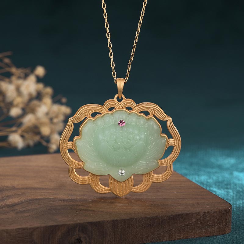 Jade Lotus Harmony Pendant - Carved celadon jade lotus in gold openwork frame with pink gem on wood, jade necklace