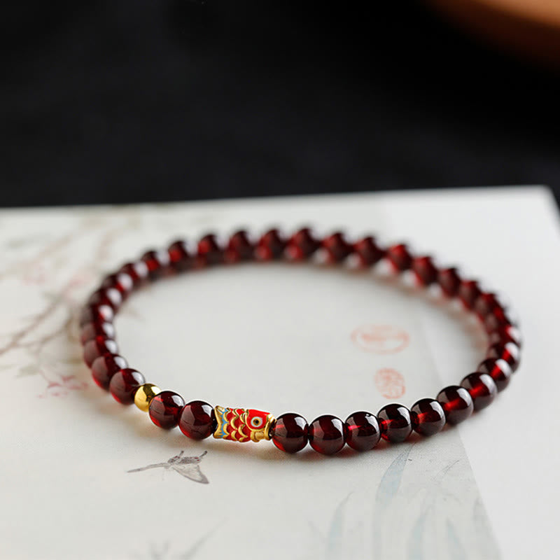 999 Gold Koi Fish Bracelet – full front view on white, garnet beads, koi fish charm, gold koi bracelet