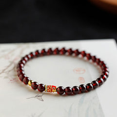 999 Gold Koi Fish Bracelet – full front view on white, garnet beads, koi fish charm, gold koi bracelet