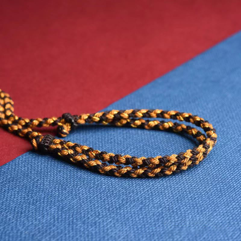 Tibetan King Kong Knot Prayer Wheel Necklace – adjustable sliding knot on braided cord close-up, woven jewelry