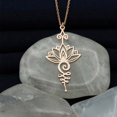 Lotus Luck Wealth Titanium Necklace – rose gold lotus with spiraling unalome on polished stone, luck