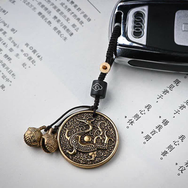 Four Symbols Constellation Key Chain - Bronze dragon pendant keychain at angled view with braided cord, Lucky