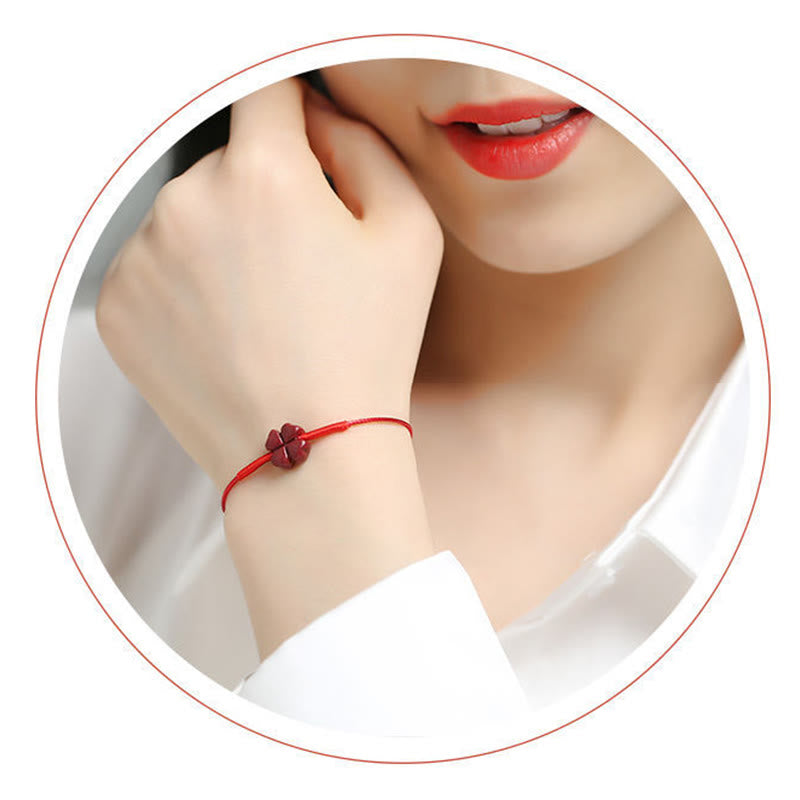Cinnabar PiXiu Lotus Koi Fish Blessing Braid Bracelet – circular cropped model wearing four-leaf clover charm, elegant red string bracelet