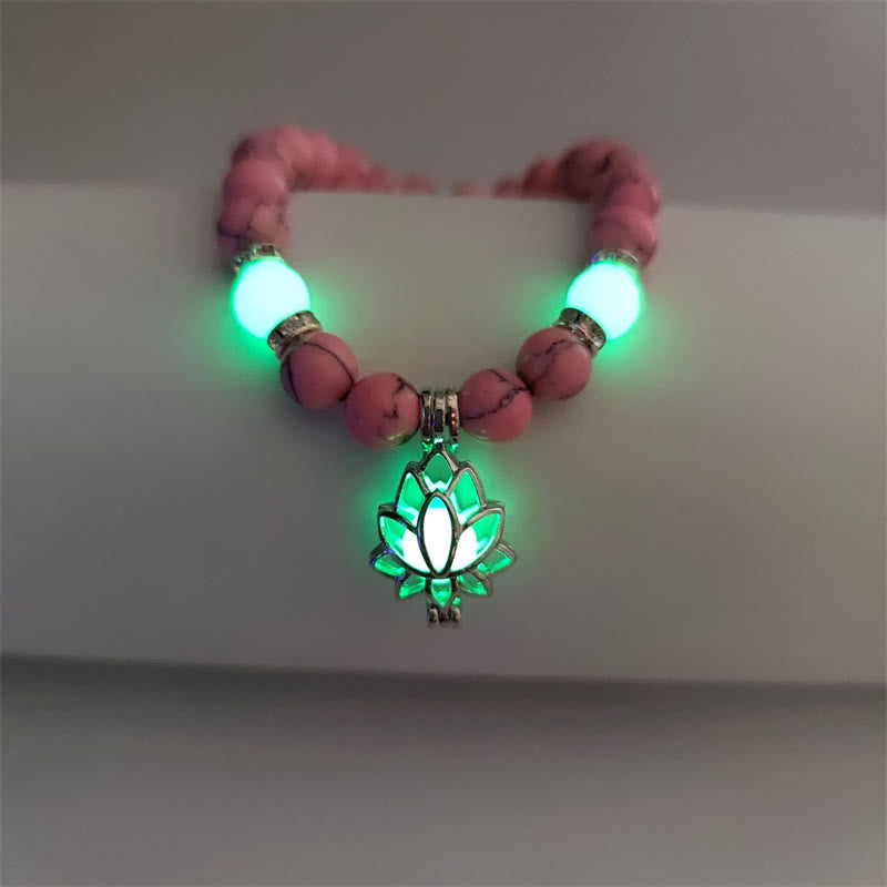 Tibetan Turquoise Glowstone Lotus Bracelet – pink howlite beads with cyan-green glow and lotus charm, pink lotus bracelet