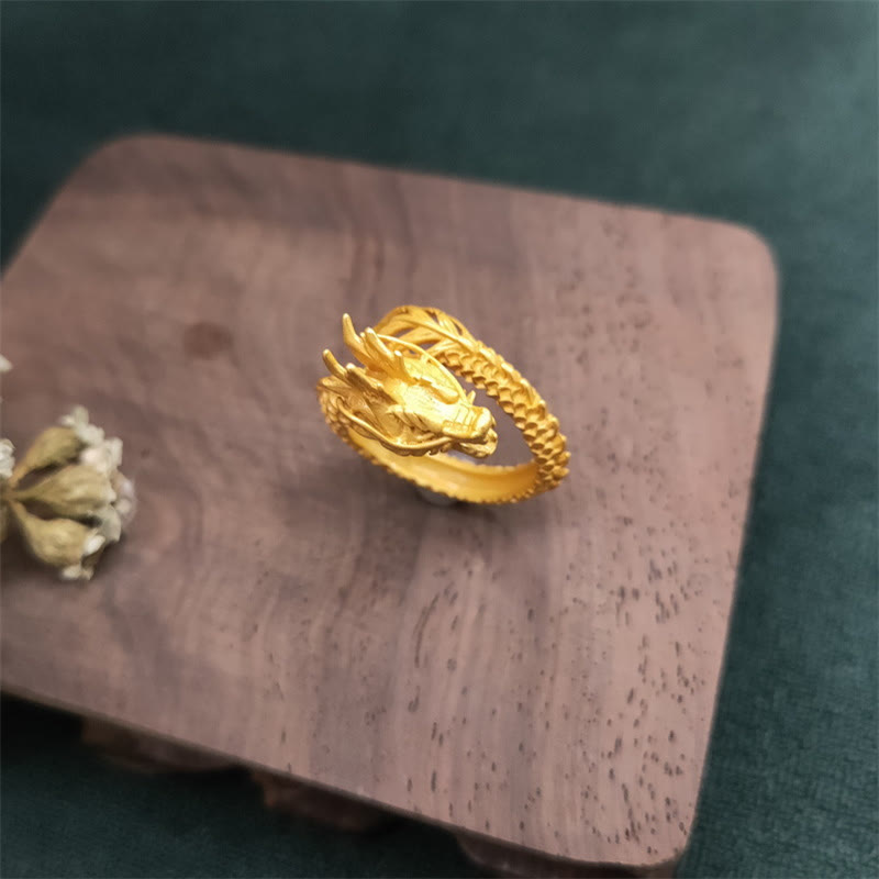 Golden Dragon Success Strength Ring - matte gold dragon on wooden pedestal, statement jewelry piece
