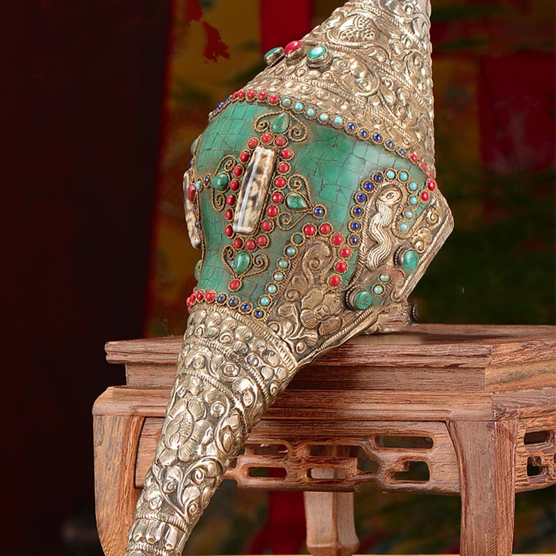 Double Dorje Shankha Conch – held upright showing dorje handle base and conch mouth, ritual implement