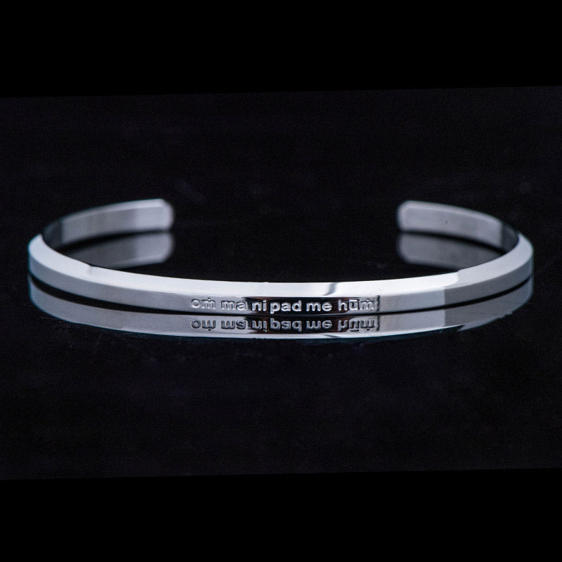 Om Mani Padme Hum Engraved Bracelet – silver cuff front view with mantra engraving, steel bangle