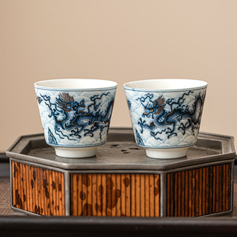 Blue & White Dragon Ceramic Teacup – pair on bamboo metal stand, copper-red dragon mane, elegant