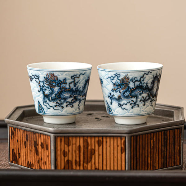 Blue & White Dragon Ceramic Teacup – pair on bamboo metal stand, copper-red dragon mane, elegant