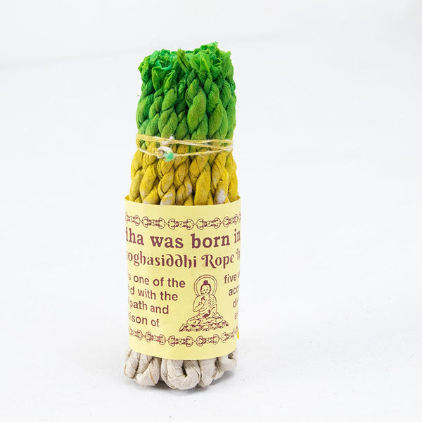 Nepal Rope Incense - green-yellow Amoghasiddhi bundle on white, balancing