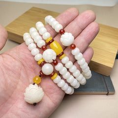 Lotus Bodhi Seed Mala 108 Beads - white prayer beads with lotus carving in hand, bodhi wrist mala