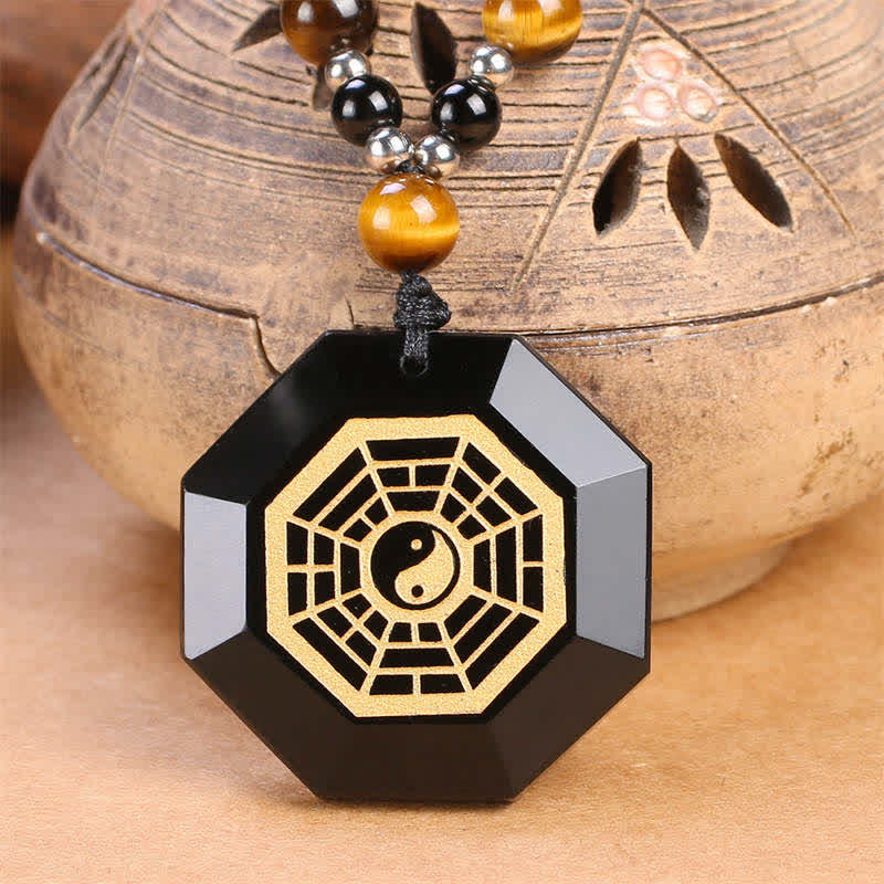 Black Obsidian Tiger Eye Bagua Yin Yang Pendant - Octagonal black obsidian bagua pendant with gold yin yang on tiger eye bead