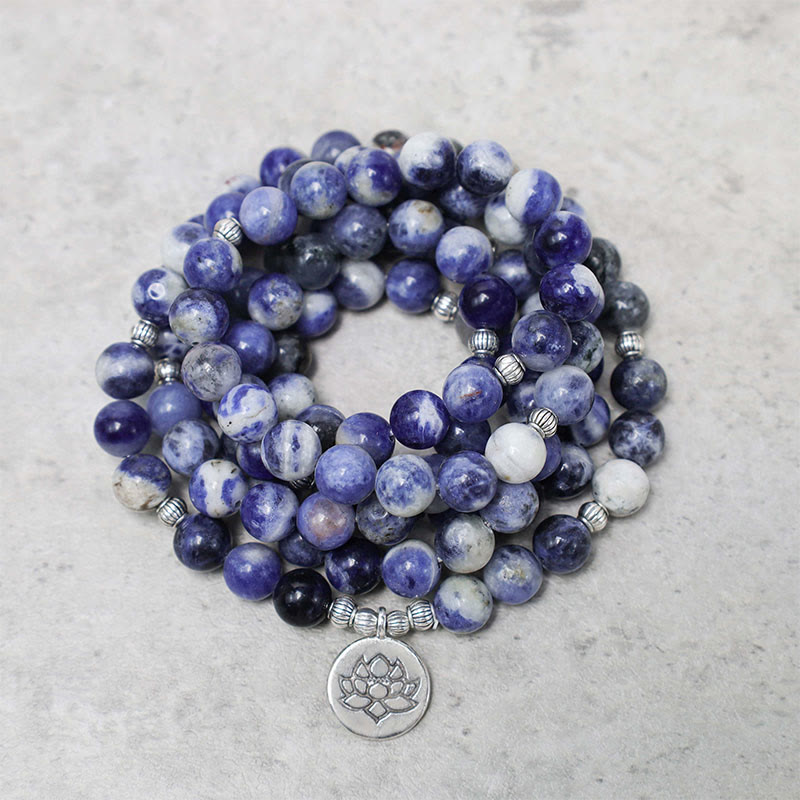 Blue Aventurine Lotus Peace Bracelet – coiled multi-strand beads with silver lotus charm on gray stone, natural gemstone wrap bracelet