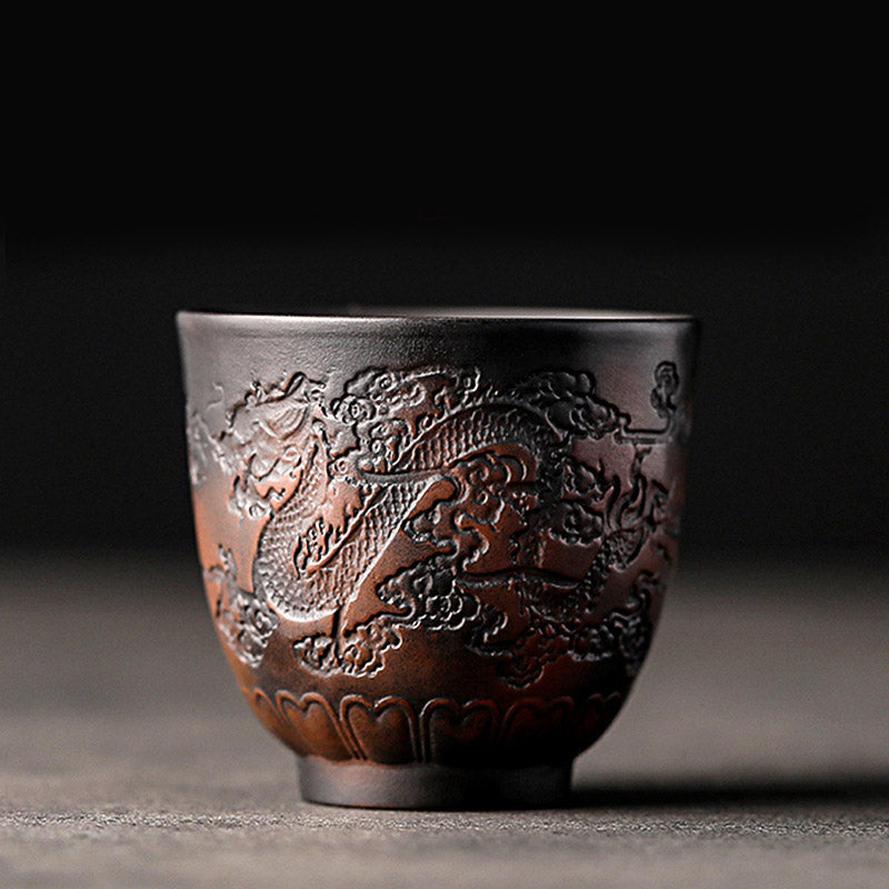 Ceramic Tea Cup – Dragon and cloud relief carving, copper tones on dark clay, traditional tea ware