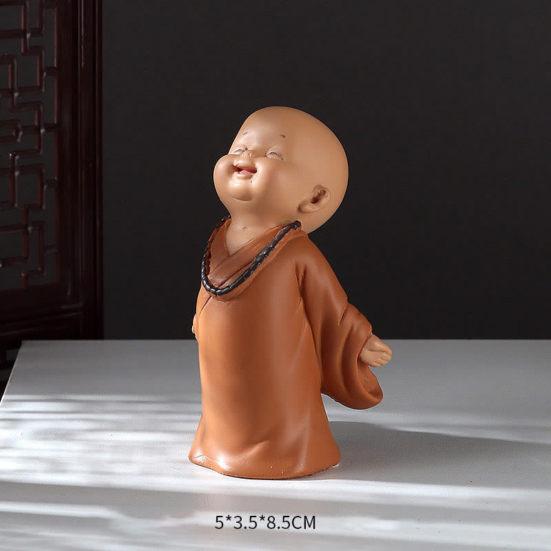 Mini Praying Monk Decor – monk under warm tungsten light creating cozy glow, evening decor shot