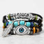Tibetan Turquoise Evil Eye Bracelet – black leather and turquoise beads with silver evil eye charm and feather pendant